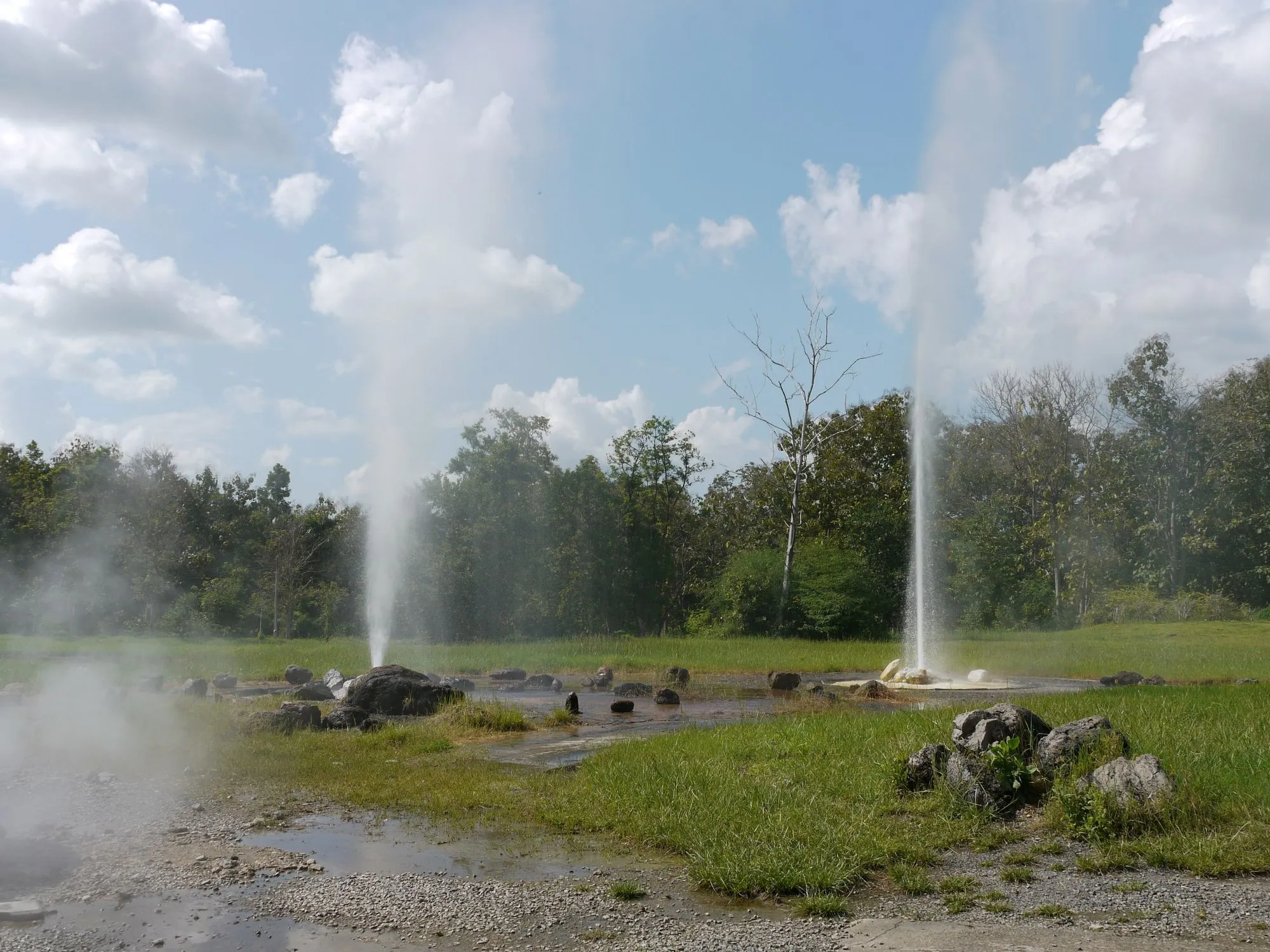 Steam rising from the geyser at San Kamphaeng hot springs